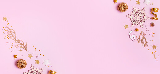 Christmas banner with minimalistic composition on pink background with golden decor and copy space