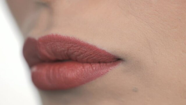 Macro Shot Of Lipstick Liner Being Applied To Models Lips, Cosmetic Makeup
