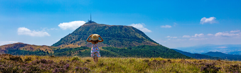 Rear view of woman tourist in Auvergne,  Puy de Dome in France