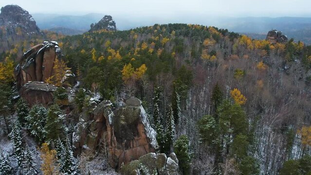 Autumn landscape flight over the National Park in Siberia, it is snowing, shooting from the air