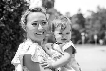 mother and child in a park on a worm summer day