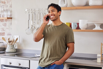 Asian man, communication and phone call in kitchen while laughing, happy and talking to contact with 5g network at home. Male with a smile while networking and having conversation about good service