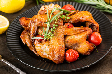 A plate of delicious roasted chicken wings
