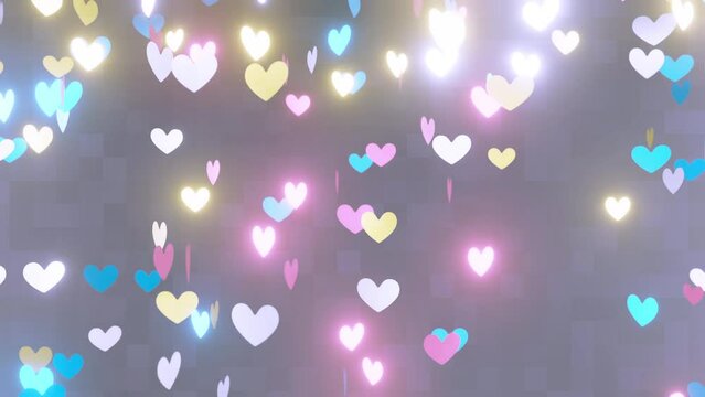 ループ再生可能な動画。キラキラしたカラフルなハート型のシェイプがくるくる回って落ちる、パーティクルアニメーション背景。4Kサイズ。