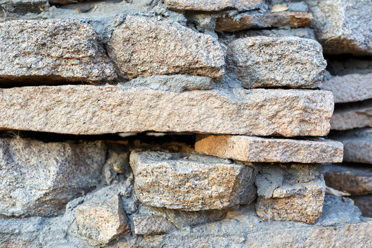 Stone walls, stone background. High quality photo. Rough masonry walls