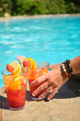 women's hands with a glass of cocktail