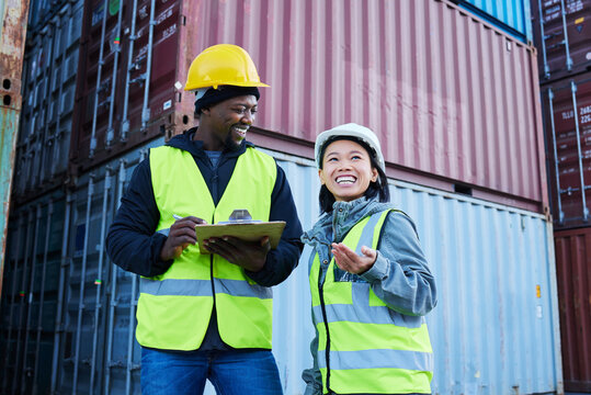 Warehouse, management and cargo stock with man and woman discuss checklist and laughing at factory plant. Logistics, shipping and colleagues working on supply chain delivery for ecommerce container