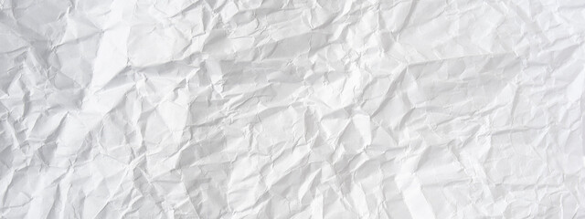 Crumpled clean white paper background. The concept of saving resources. Wrinkled paper.