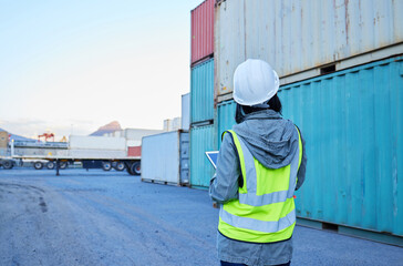 Back view, delivery and woman in logistics working on container inspection at export delivery...