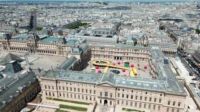 Cour Carr&eacute;e or Square Court in Louvre Palace during fashion show. Paris cityscape, France. Aerial drone panoramic view