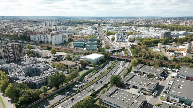 Highway and urbanscape, Paris in France. Aerial forward