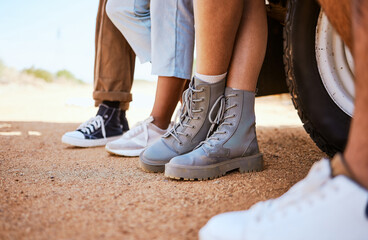 Car road trip, desert and legs of people relax on travel adventure in Australia for fun journey, peace and freedom. Ground floor, shoes and feet of friends group with motor transportation for driving