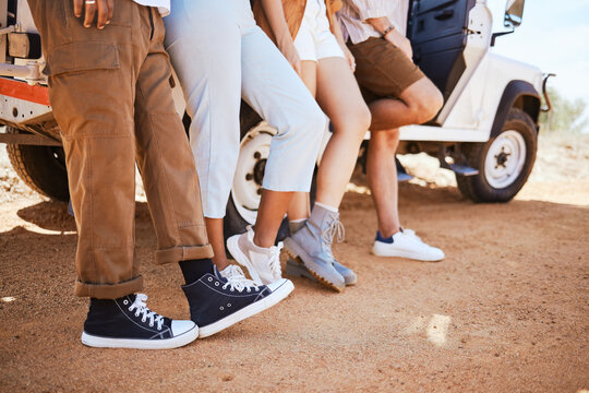 Travel, Shoes And Friends Bonding In Road, Standing Together On A Desert Journey And Taking A Break. Adventure, Fun And Freedom By Group Of Travellers Exploring Earth And Stop To Enjoy View Together