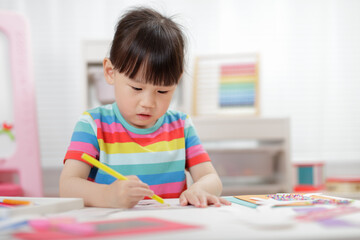  young girl  making craft for homeschooling