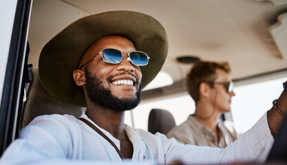 Happy, smile and black man driving a car while on a summer road trip vacation with friends....