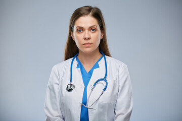 Serious doctor woman with stethoscope. Isolated portrait of female medical worker