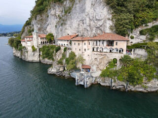 Fototapeta na wymiar Drone view at the monastery of Santa Caterina del Sasso on lake Maggiore, Italy