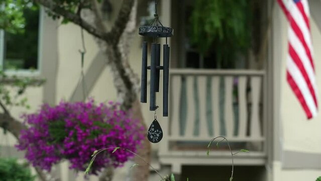 Wind Chimes Hanging From Tree In Front Of Carmel Porch.