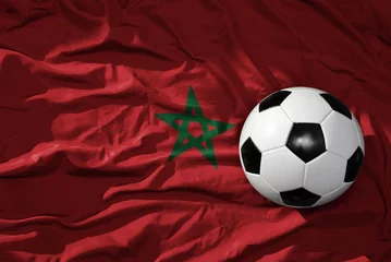 Foto op Canvas vintage voetbalbal op de golvende nationale vlag van marokko achtergrond. 3D illustratie © luzitanija