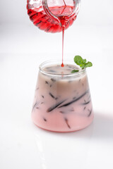 Air Bandung Cincau or Sirap Bandung is a popular drink in Malaysia, Singapore and Brunei, made from milk, sirap and grass jelly.