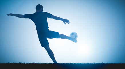 Football soccer player shooting a ball on goal