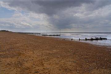 Fototapeta premium Summer rain clouds gather ominously over Hunstanton beach.
