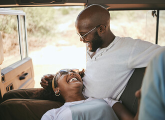 Road trip, black couple and travel during drive through nature on a summer vacation with a smile, happiness and love. Happy man and woman laughing and bonding on safari journey or trip together © S Fanti/peopleimages.com