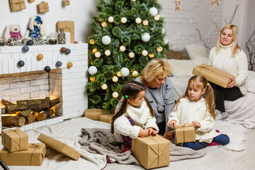 Merry Christmas and Happy Holidays. Grandma and children. The morning Xmas. Portrait loving family