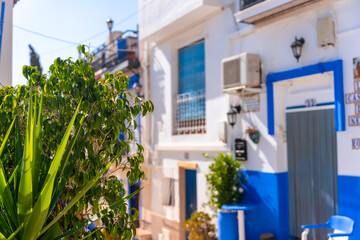 Fototapeta na wymiar White houses in the Santa Cruz neighborhood in Alicante, Mediterranean houses. Valencia