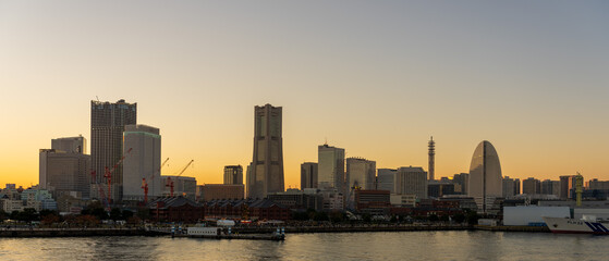 Fototapeta na wymiar Wide panorama of Yokohama Minato Mirai 21 seaside urban area in Japan at dusk 