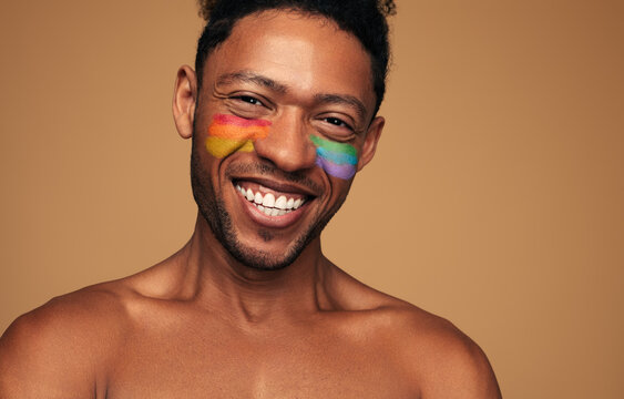 Cheerful black gay looking at camera with smile