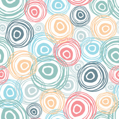 Scattered scribble circles on a white background. Pastel colors. Abstract seamless pattern. Hand drawn elements background for wrapping, fabric, wallpaper or cards.