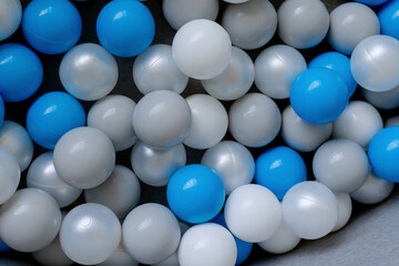 Multi-colored balls for the development of the child. Small pool to play