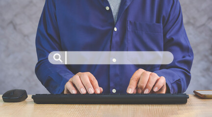 Close up of man hand using computer keyboard to searching information on web browser with search...