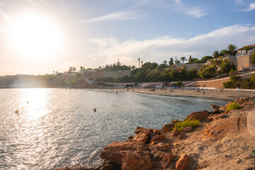 Fototapeta na wymiar Sunset at La Caleta beach in summer in Cabo Roig. Alicante