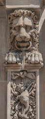 Scary lion head as decorative figure at facade of the Cathedral of Milano, Milan, Italy, closeup,...