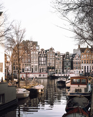 Fototapeta na wymiar Amsterdam Panoramic view of canal during end of the day grey Netherlands