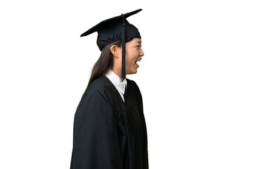 Young university graduate Asian woman over isolated background laughing in lateral position