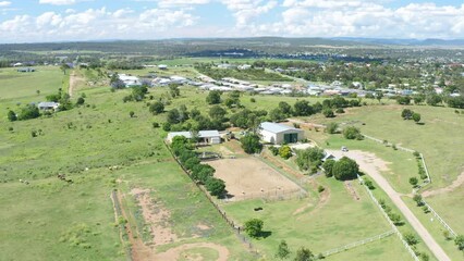 4K Aerial Drone Flyover Horse Farm Ranch On Green Hill Countryside In Australia