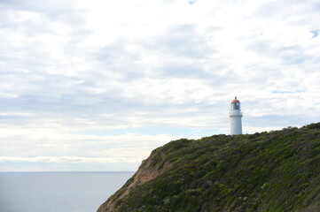 Fototapeta na wymiar A lighthouse on the hill