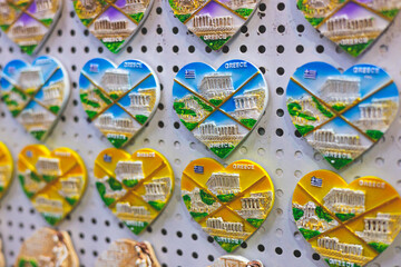 View of traditional tourist souvenirs and gifts from Athens, Attica, Greece with fridge magnets with text 