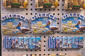View of traditional tourist souvenirs and gifts from Athens, Attica, Greece with fridge magnets...