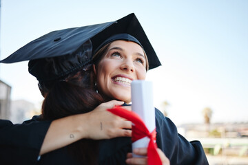 Graduation, women and students celebrate achievement with a hug, in gown and successful together as...