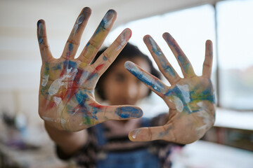 Hands, paint and art with a woman creative artist or painter having fun in her studio or design workshop. Palm, color and artistic with a female working in a classroom or gallery for creativity