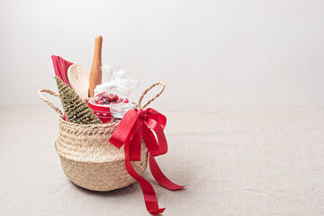 Refined Christmas gift basket for culinary enthusiats with mug, fruit tea and kitchen utensils....
