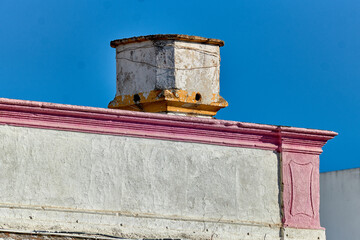 Traditional chimney on the roof of a houses in Olhao, Faro district, Algarve, Portugal