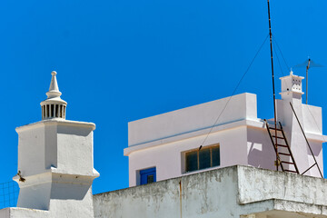 Traditional chimney on the roof of a houses in Olhao, Faro district, Algarve, Portugal