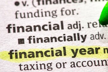 Close up photo of the words financial year in a dictionary book