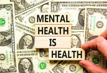 Mental health psychological symbol. Concept words Mental health is health on wooden blocks on a...