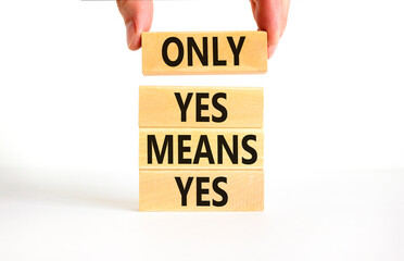 Only yes means yes symbol. Concept words Only yes means yes on wooden blocks on a beautiful white table white background. Businessman hand. Business, psychological only yes means yes concept.